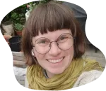 A bird sitting on a nest of eggs.